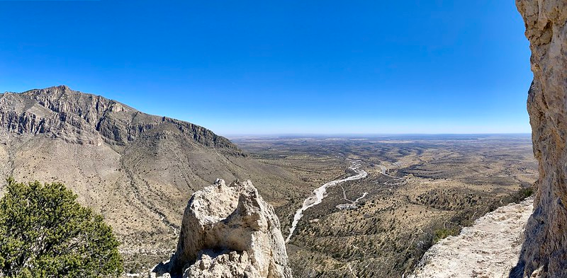 A view of a mountain range from a rocky cliff in Guadalupe mountains NP