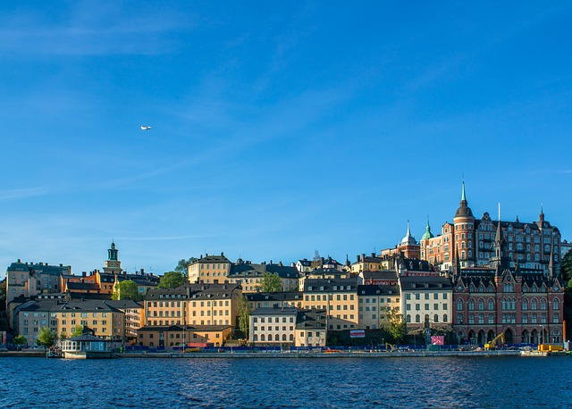 A section of stockholm next to a body of water.