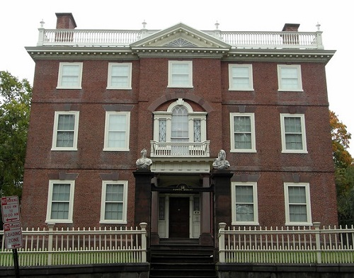 The John Brown House Museum with a white fence around it