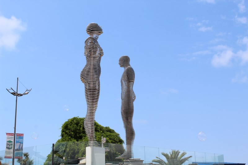 A statue of a man and a woman standing next to each other in Georgia