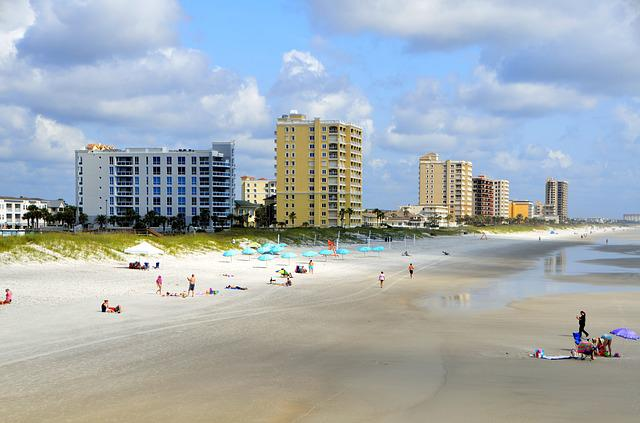 miami beach with a lot of people and buildings in the background