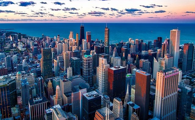 An aerial view of the Chicago skyline with a body of water in the background.