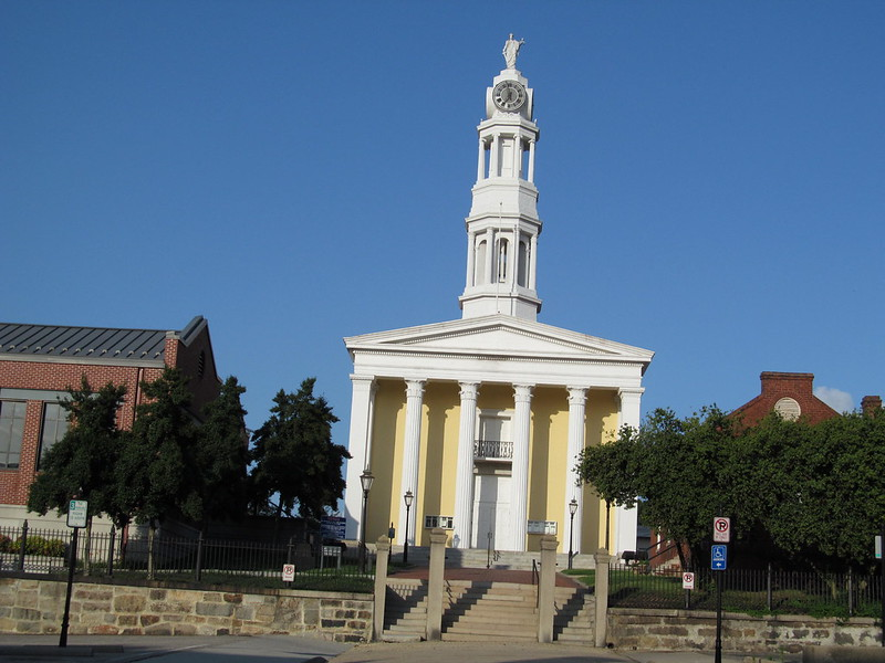 A large building with a clock tower on top of it in petersburg