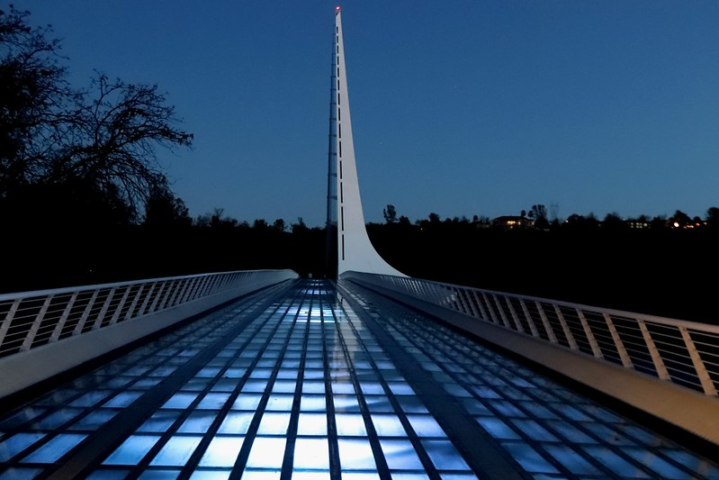 the sundial bridge is lit up at night