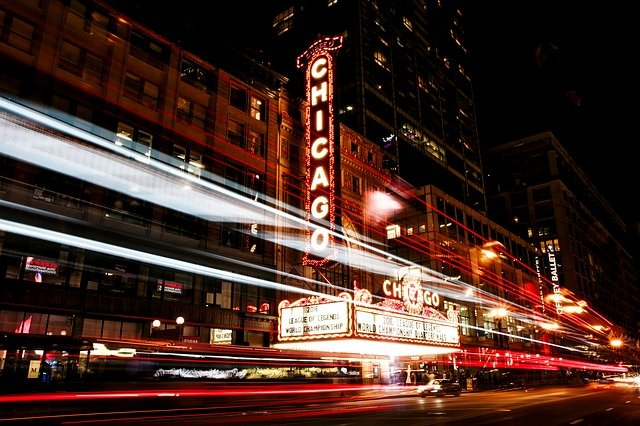 A long exposure photo of a chicago theater at night.