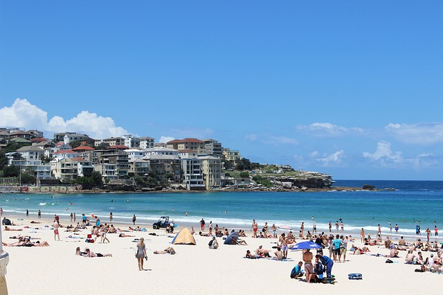 A beach filled with people on a sunny day