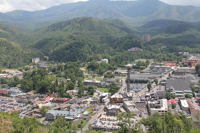 An aerial view of Gatlinburg with mountains in the background.
