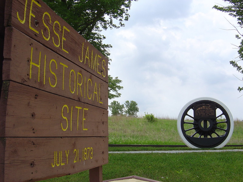 A wooden sign that says jesse james historical site