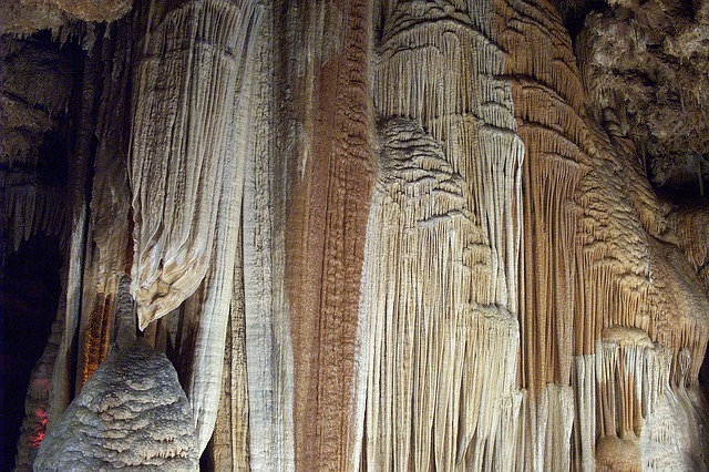 A large rock formation in a cave in stanton with a lot of stalactites hanging from it.