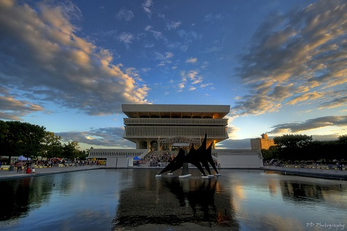 the new york state museum with a fountain in front of it.