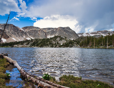 A lake with mountains in the background in Medicine Bow-Routt National Forests