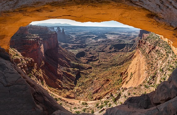 A view of a canyon from inside a cave in Canyonlands NP