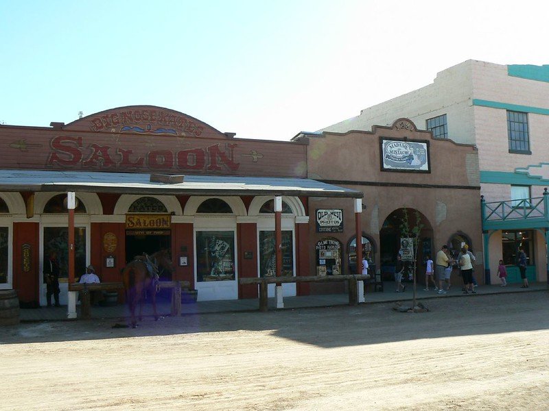 A saloon with people standing outside of it in tombstone