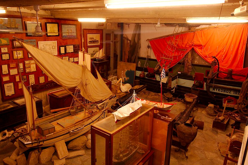 A room with a lot of boats in it in the mykonos folklore museum