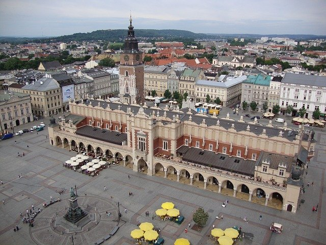 An aerial view of Krakow with a large building in the middle