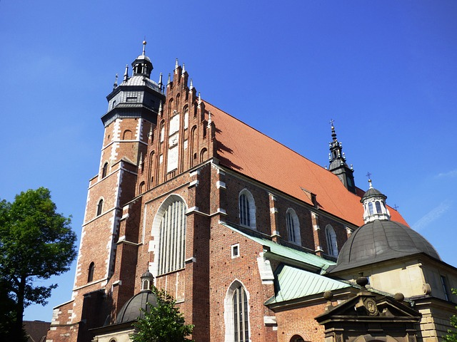 A large brick church with a red roof in Krakow