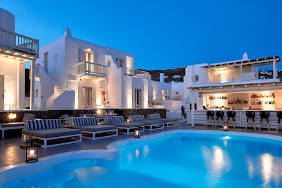 a large swimming pool in the middle of the mykonos princess hotel.