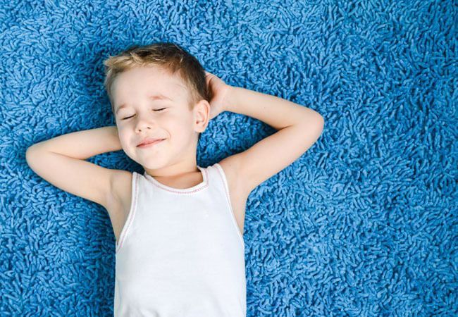 smiling kid on carpet smiling kid on carpet