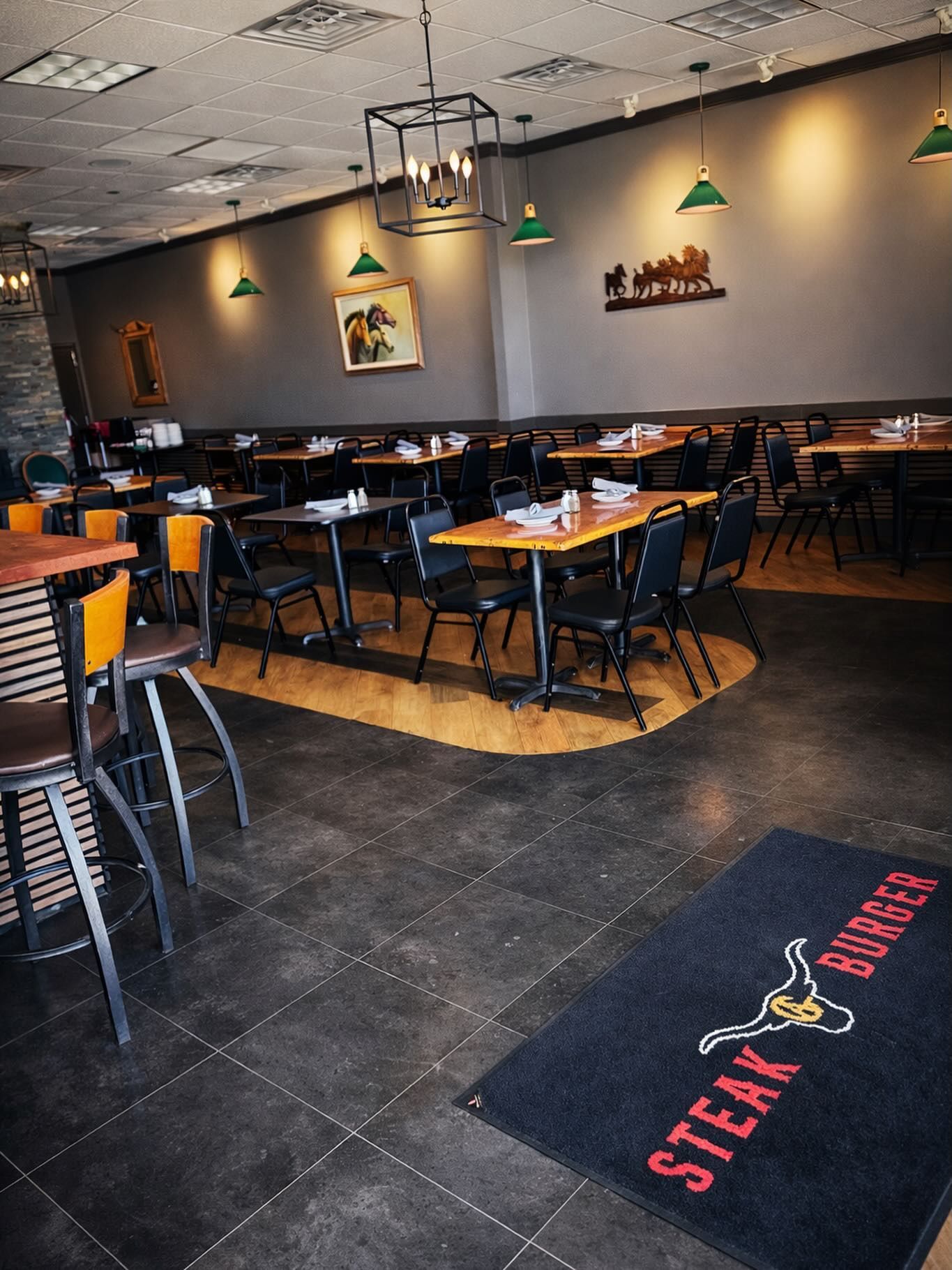 Inside a restaurant featuring a dark-tiled floor, a