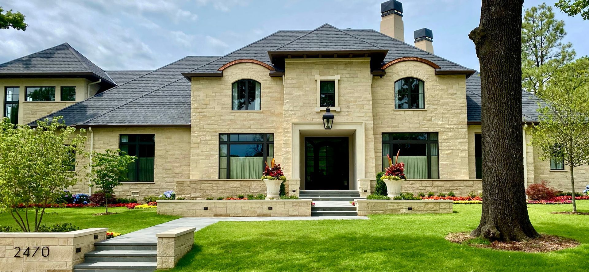 Silverdale cut stone caps, sills, window & door surround and Silverdale 3 Rise Split Face Veneer used at a residence