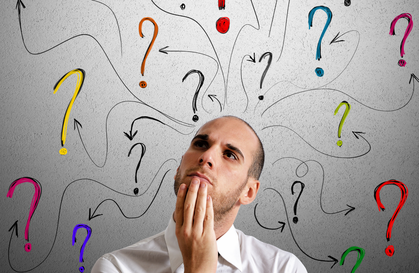 Man surrounded by a cloud of questions, deep in thought.