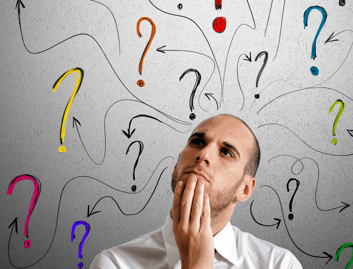 Man surrounded by a cloud of questions, deep in thought.