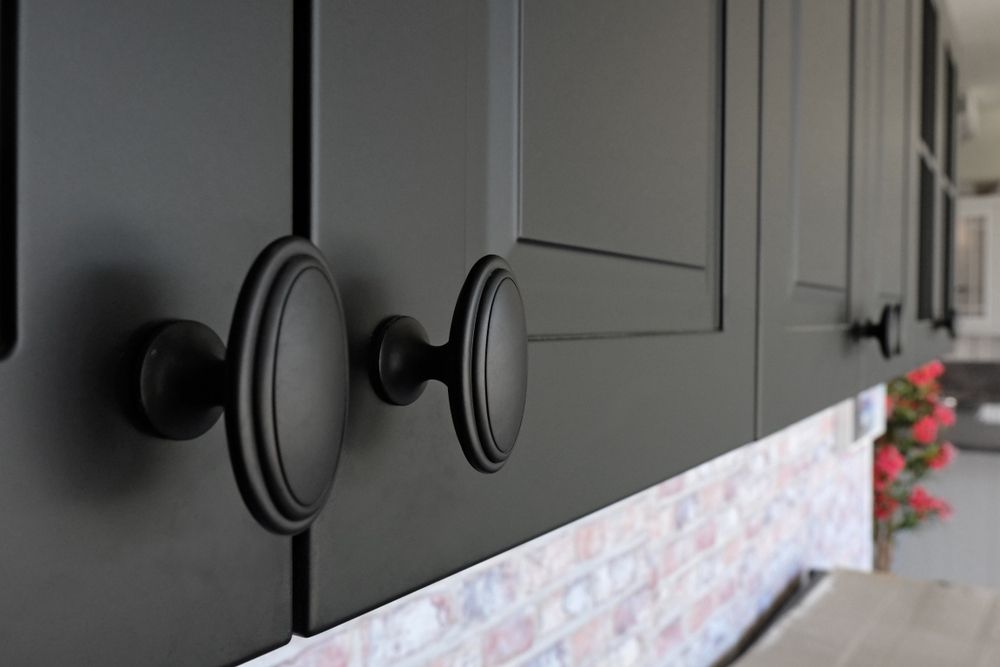 A Kitchen With A Large Island And A Clock On The Wall — Gavin Cummings Kitchens in Dubbo, NSW