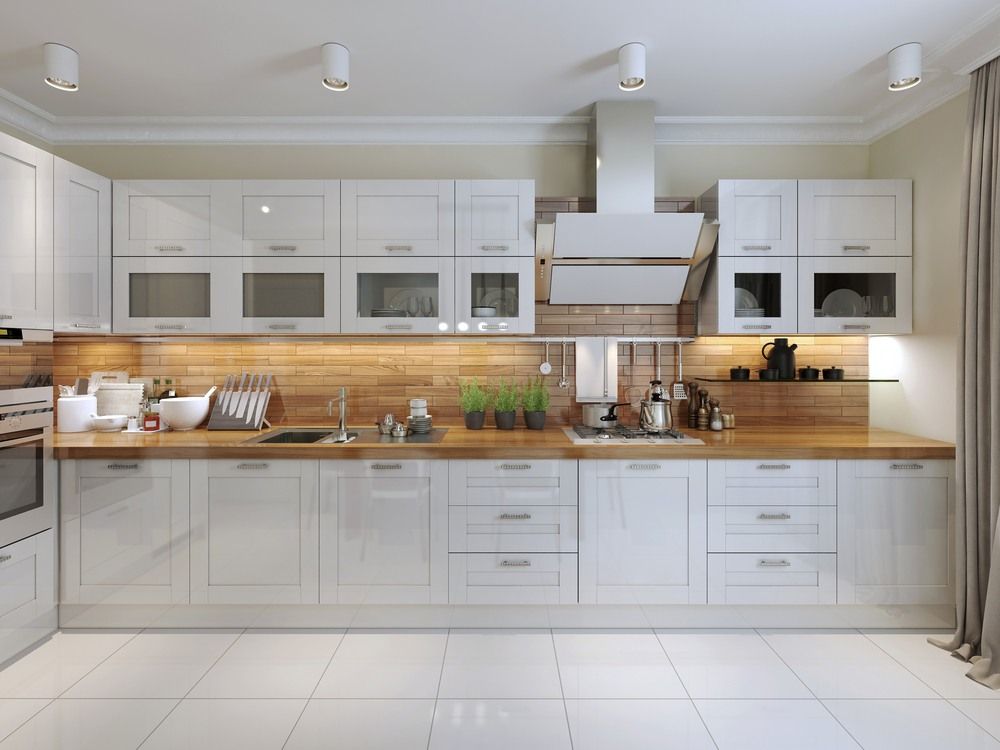 A Modern Kitchen With White Cabinets and Wooden Counter Tops — Gavin Cummings Kitchens in Dubbo, NSW