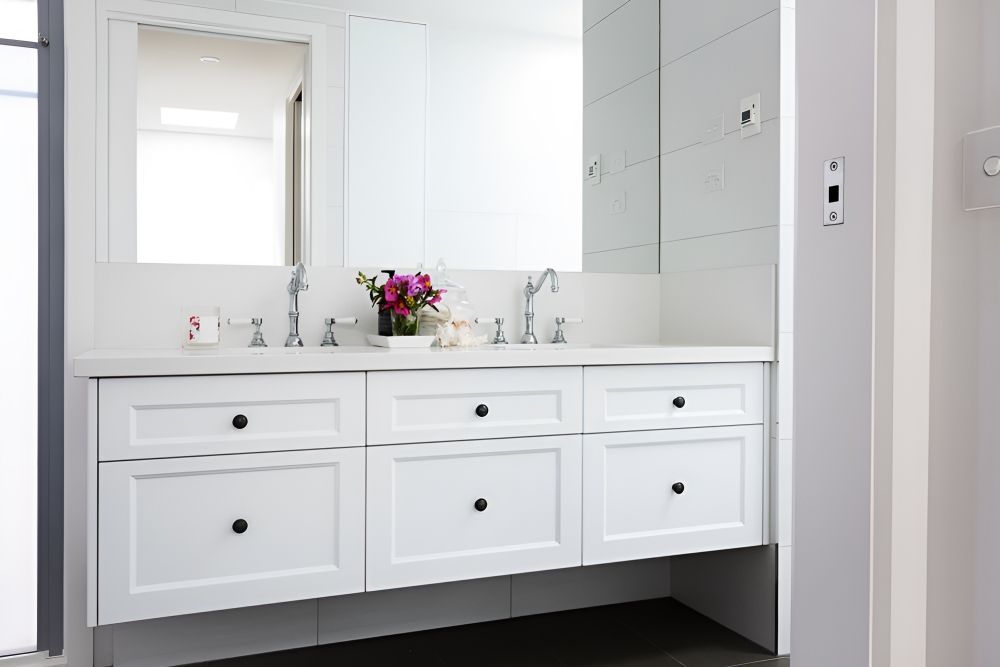 A Bathroom With Two Sinks, A Mirror, And White Cabinets — Gavin Cummings Kitchens in Nyngan, NSW