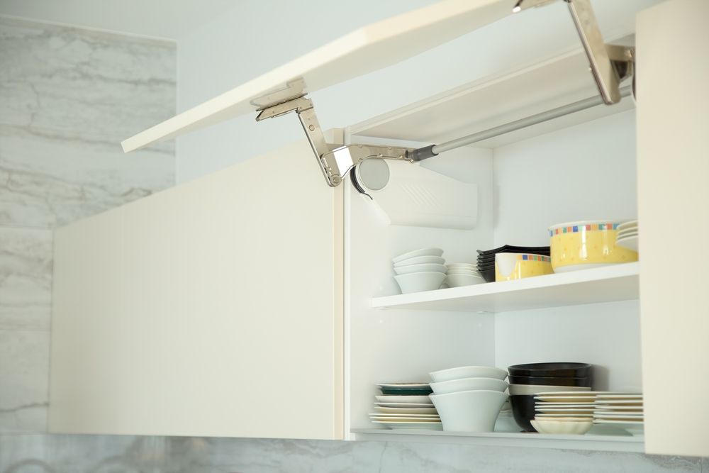 A Kitchen Cabinet With the Doors Open and Plates and Bowls on the Shelves — Gavin Cummings Kitchens in Nyngan, NSW