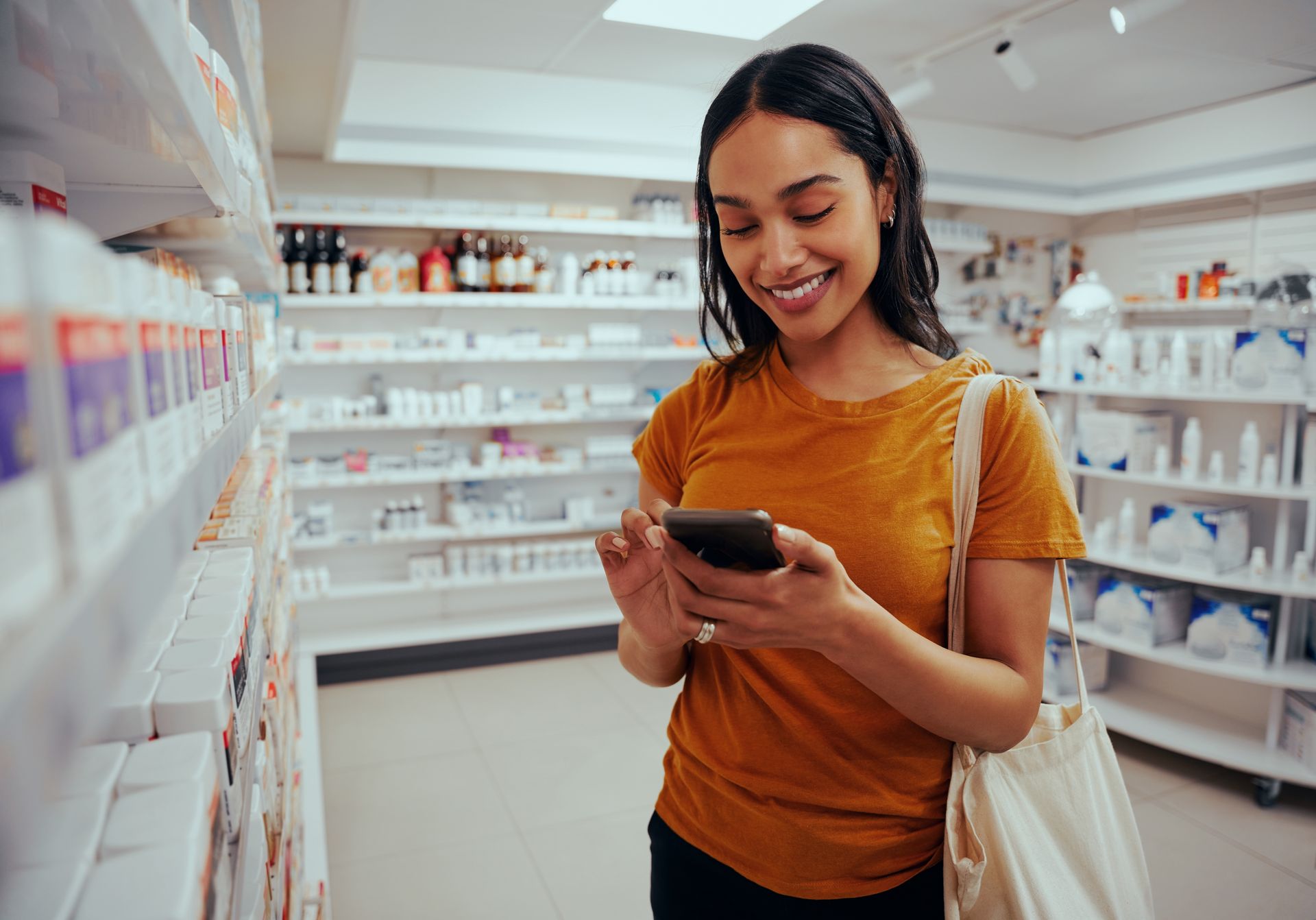 A senior woman is looking at her prescriptions at home