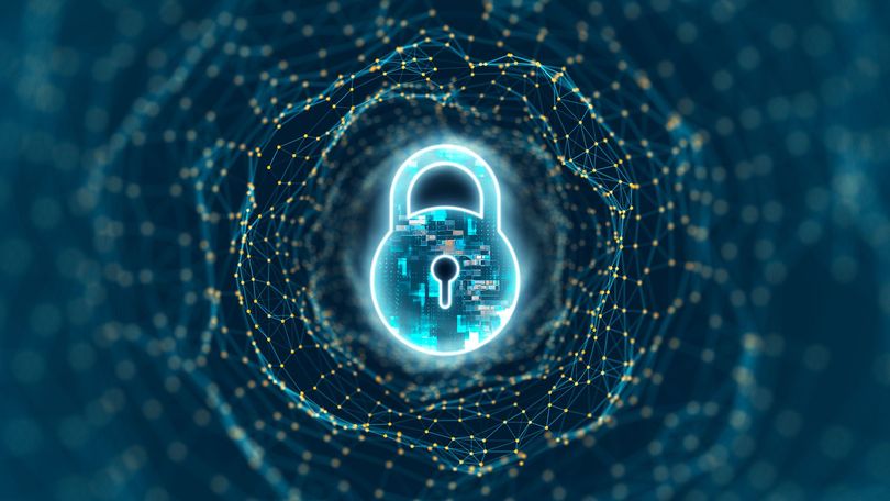 A digital padlock is surrounded by a circle of particles on a blue background.