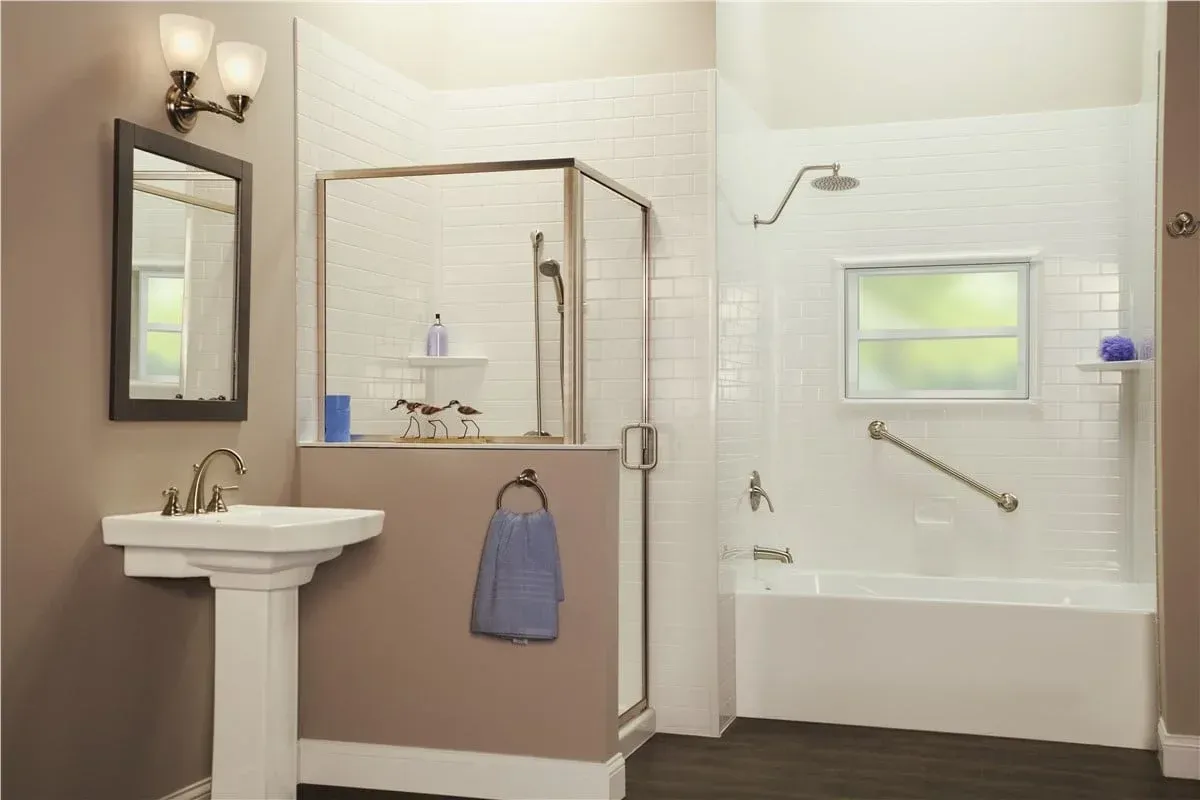 Accessible bathroom with sink, shower seat, grab bar, and tub in a beige-and-white interior