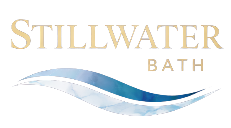 Stillwater Bath logo with gold text and blue wave swoosh on white background