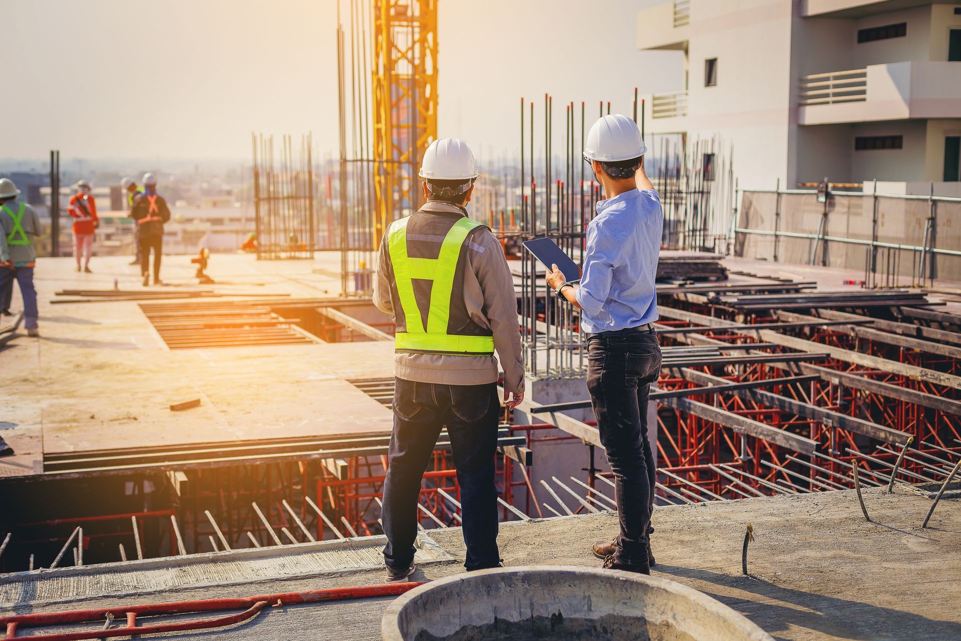 Construction workers discuss the building plans.