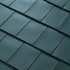 A close up of a roof with a lot of tiles on it.