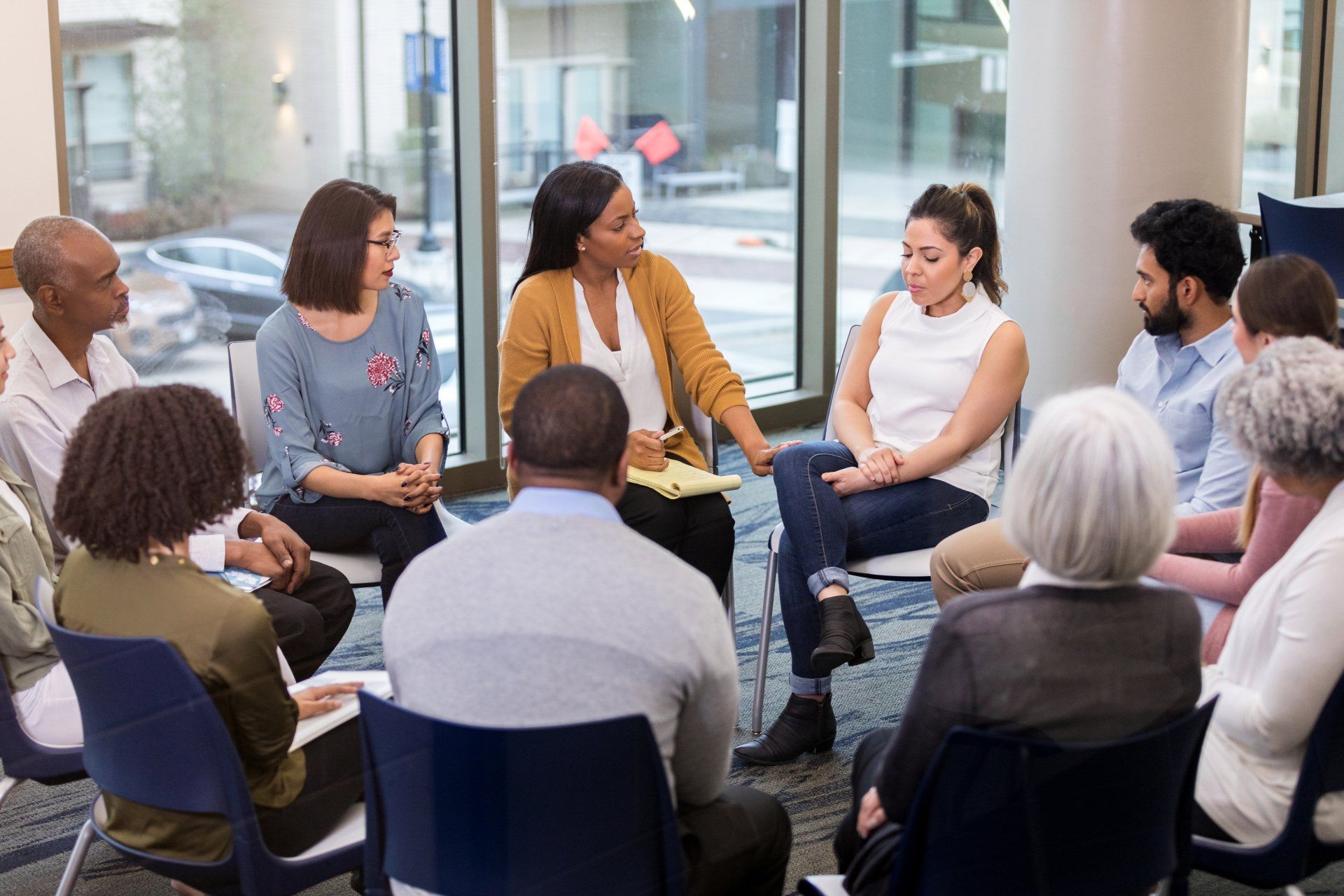Mental health professional comforts woman - Jersey City, NJ - Mental Health & Addiction Center