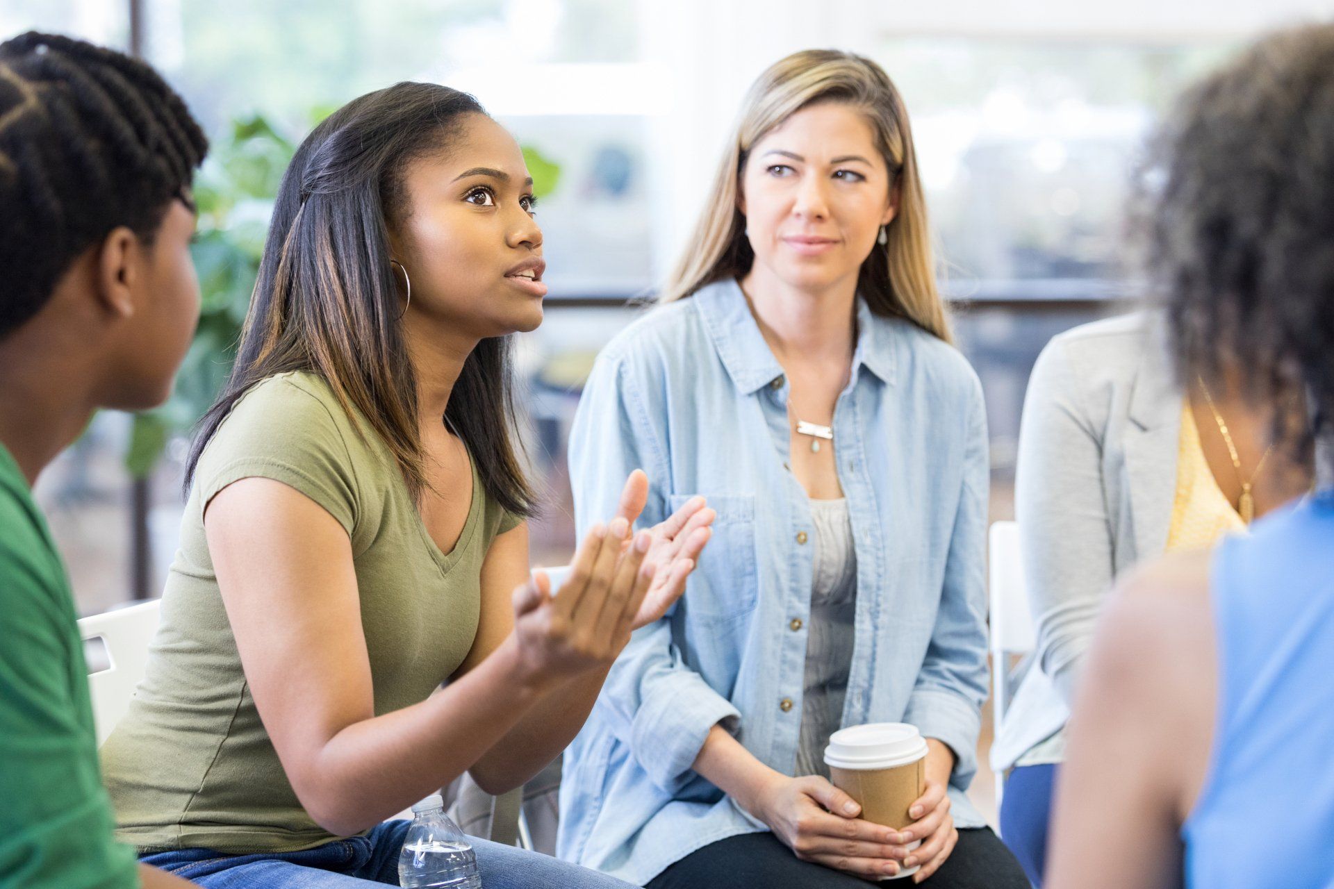 Everybody in therapy group looks at teen girl - Jersey City, NJ - Mental Health & Addiction Center