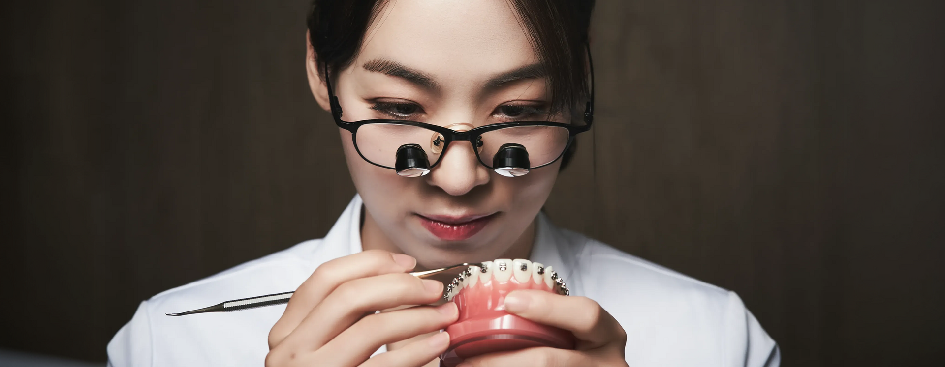 Dr. Sally Chaekyung Lee studying a dental model at Yonsei Baro Orthodontics, Seoul