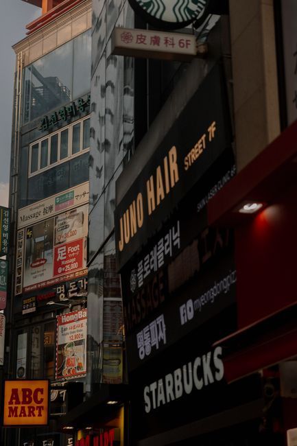 Shop signs written in Korean Hangul on a street in Seoul