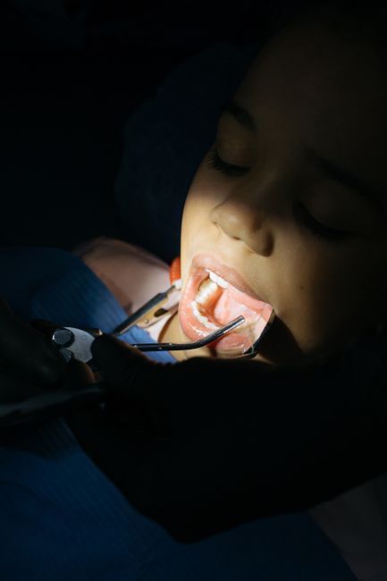 Child with mouth open during a dental examination