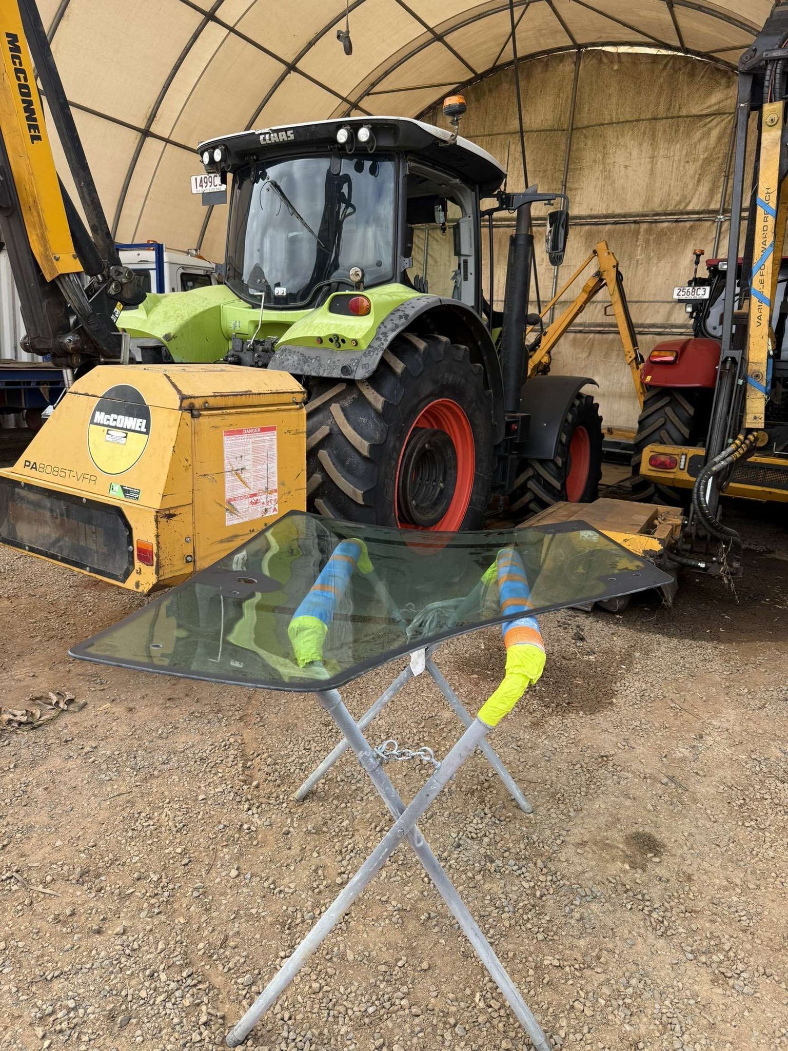 A Tractor Windshield Rests on a Folding Stand — Far North Windscreens in Mareeba, QLD