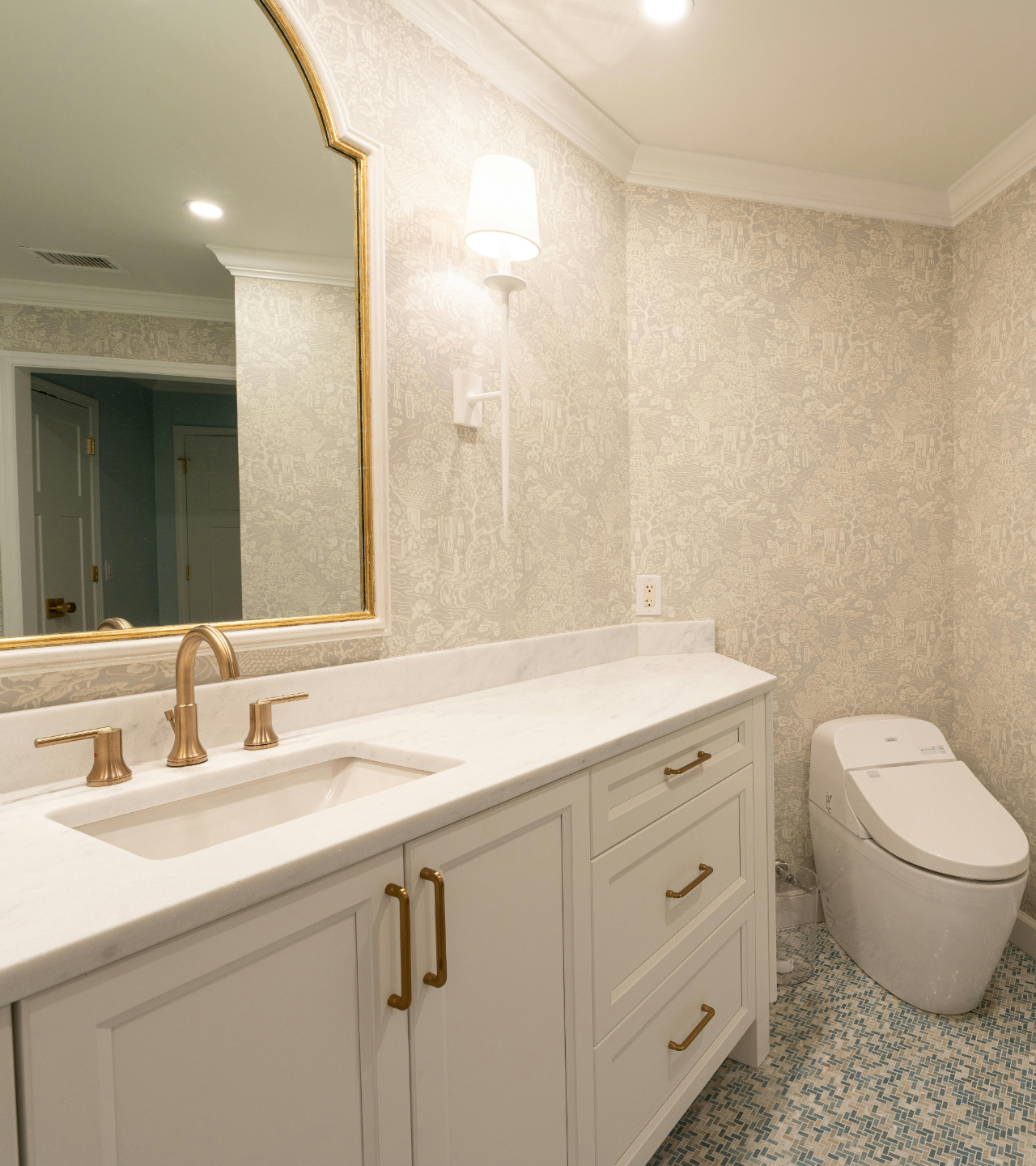 Bathroom with two white bowl sinks on a wood countertop, black faucets, mirrors, and a plant.
