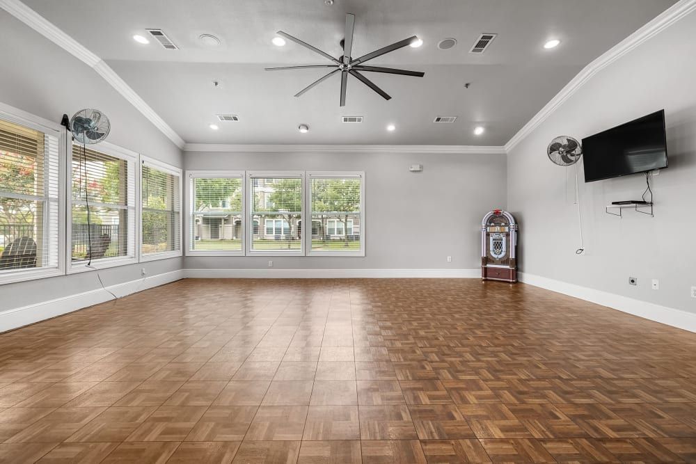 Ballroom with a wooden floor and a ceiling fan at Marquis Rockwall in Rockwall, TX.