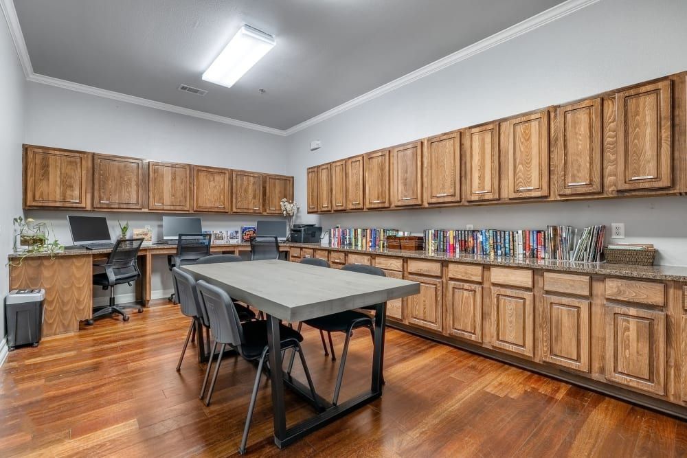 Business center with a table and chairs at Marquis Rockwall in Rockwall, TX.
