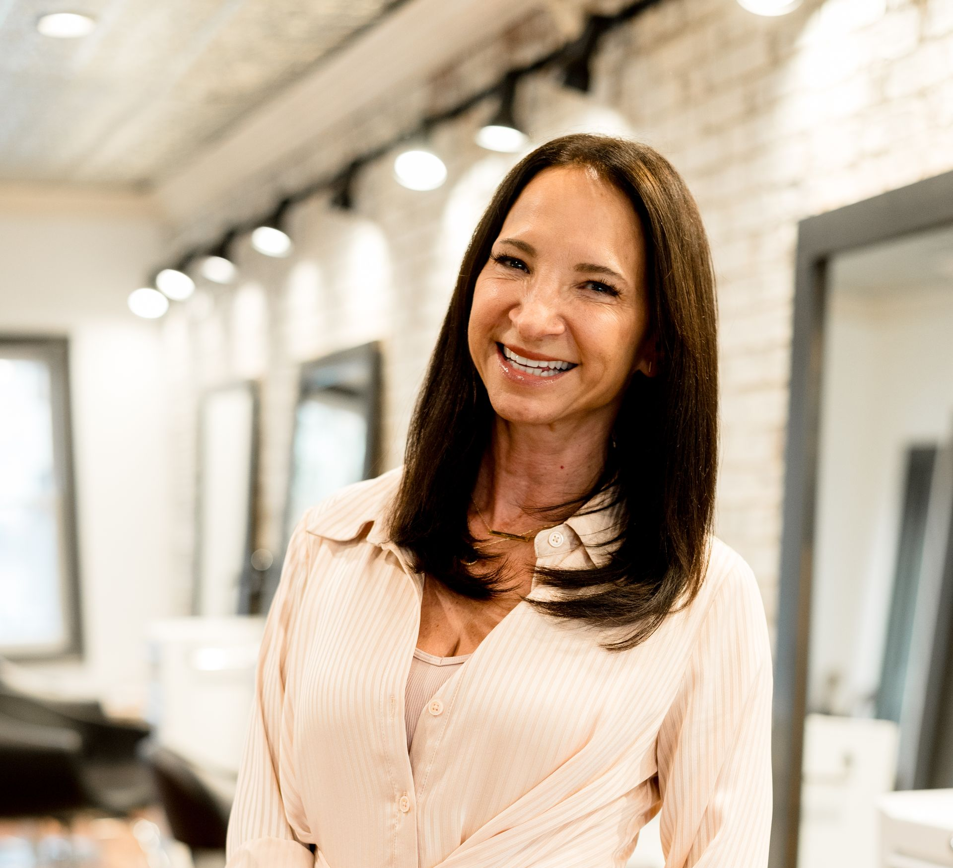 Amy in conversation with a salon owner at the front desk
