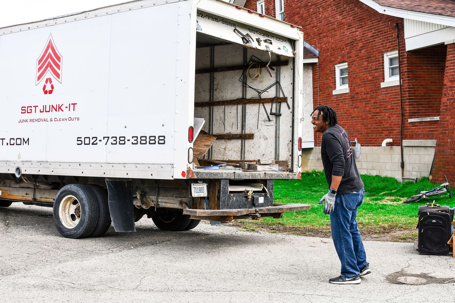 Sgt Junk-It team loading junk removal truck Louisville