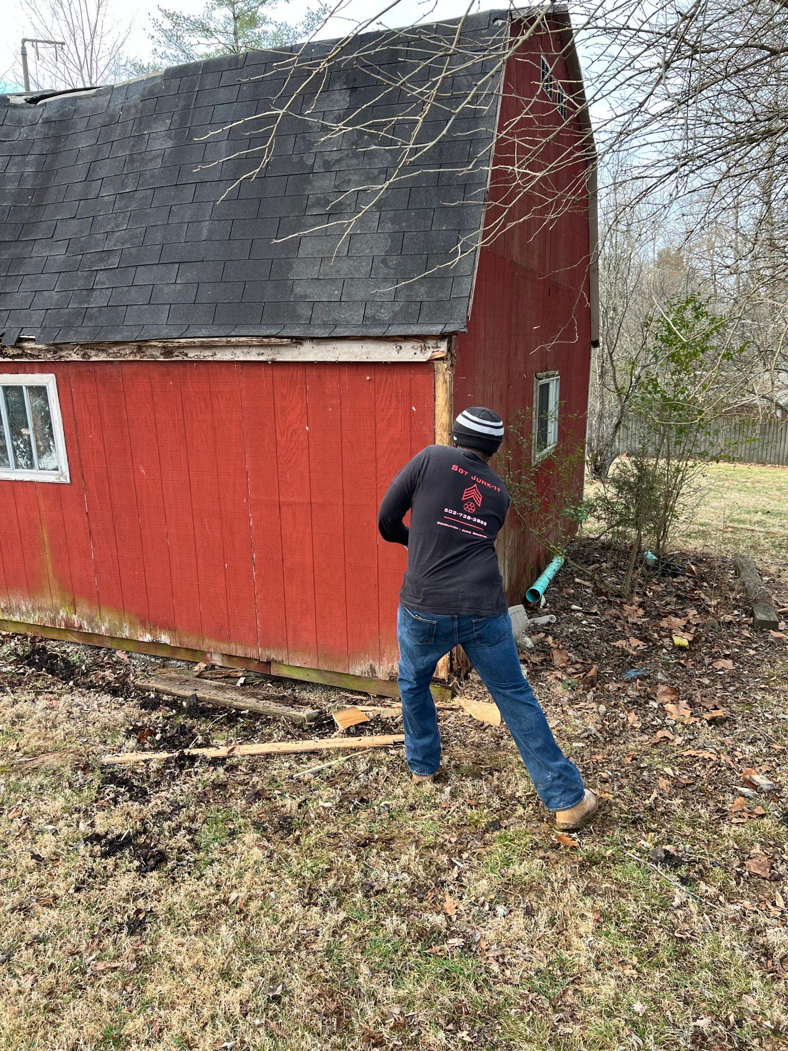 Sgt Junk-it crew doing light demolition work on a small red house in louisville ky