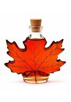 A bottle of dark bulk maple syrup.
