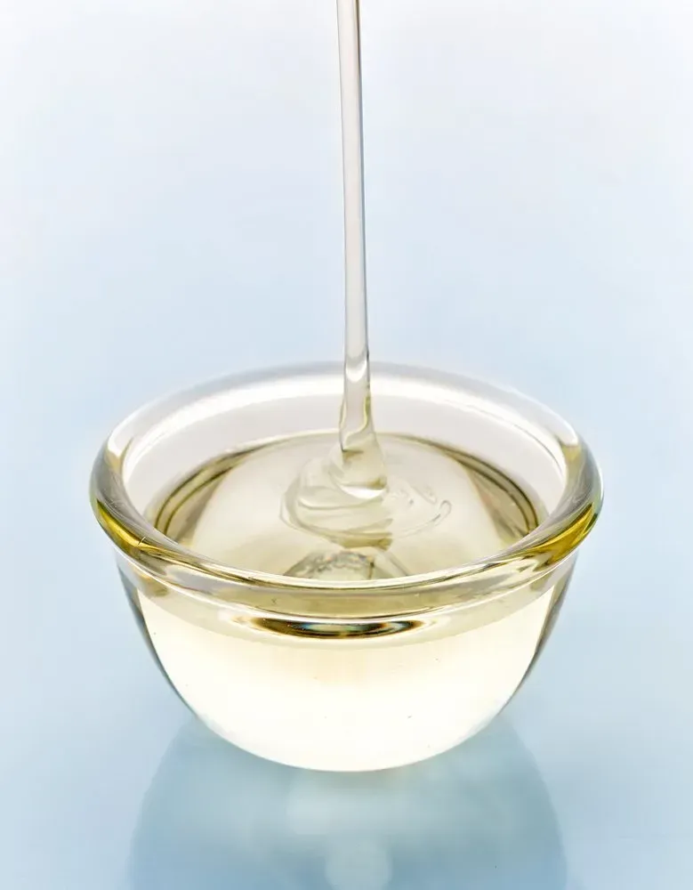 Organic liquid sugar being poured into a small bow.
